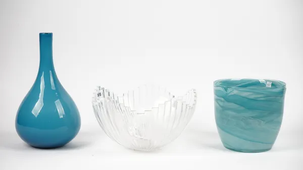 An Orrefors clear glass bowl of segmented form, 30cm diameter, a modern blue glass bottle neck vase and a modern blue glass bowl, 19cm high, (3).