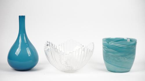 An Orrefors clear glass bowl of segmented form, 30cm diameter, a modern blue glass bottle neck vase and a modern blue glass bowl, 19cm high, (3).
