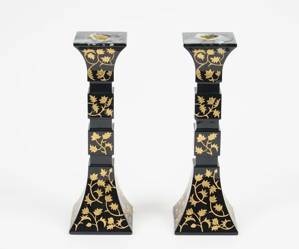 A pair of Baccarat black glass candlesticks, square section with gilt engraved foliate decoration, limited edition 19/100, etched marks, 24.5cm high,