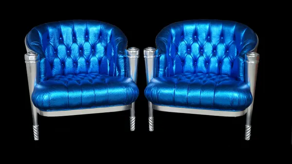 A pair of silver painted tub chairs with button back faux electric blue lizard skin upholstery on tapering supports, 79cm wide x 76cm high.