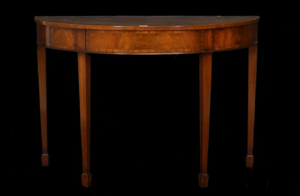 A George III style inlaid mahogany demi-lune console table on tapering square supports, 117cm wide x 82cm high.