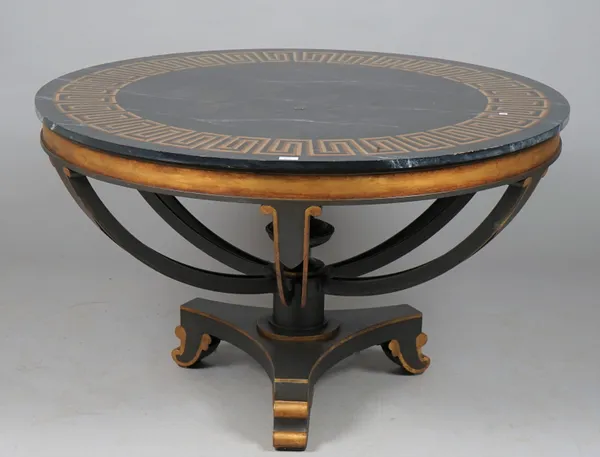 A modern Italian style black painted metal and parcel gilt faux marble topped centre table, with gold Greek key pattern border, 127cm diameter x 77cm