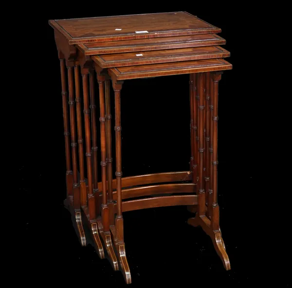 A Regency style mahogany nest of four tables on turned supports, the largest 50cm wide x 71cm high, (a.f.).
