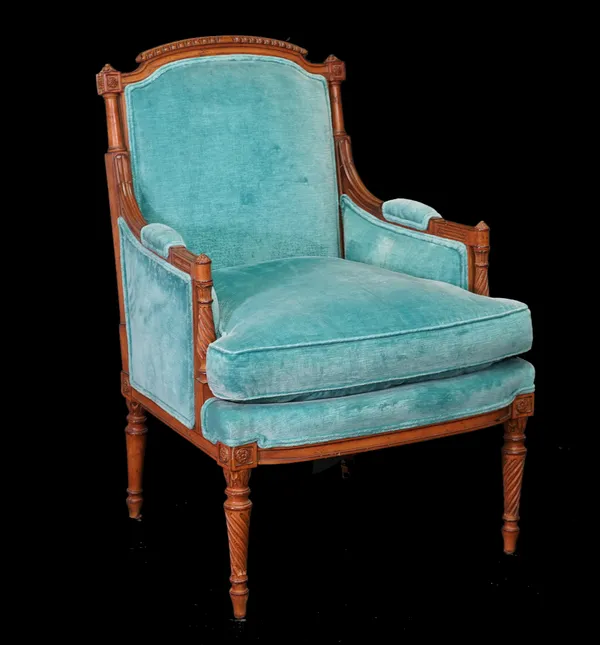 A Louis XVI style stained beech armchair on spiral twist reeded supports with teal blue upholstery, 63cm wide x 102cm high.