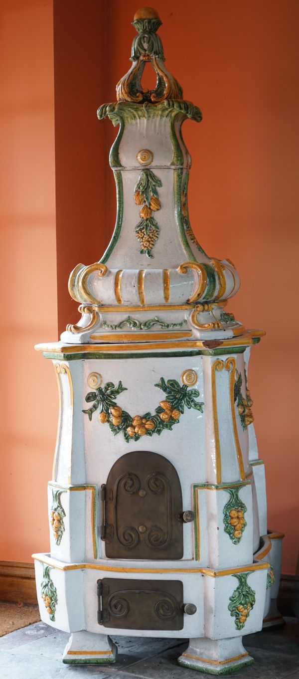 A Continental glazed terracotta stove, 190cm high.