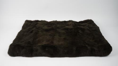 A dark brown fur throw, 180cm x 124cm.