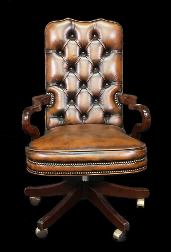 A modern hardwood framed office open armchair with brown button back leather upholstery, 61cm wide x 106cm high.