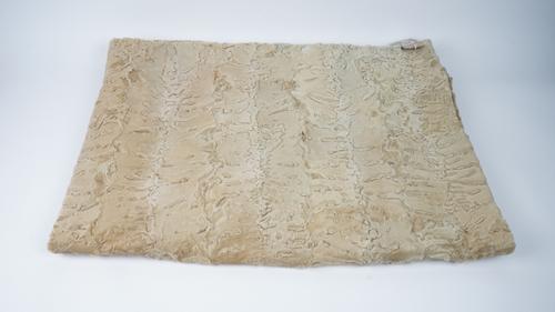 A beige bovine fur throw, 134cm x 189cm.