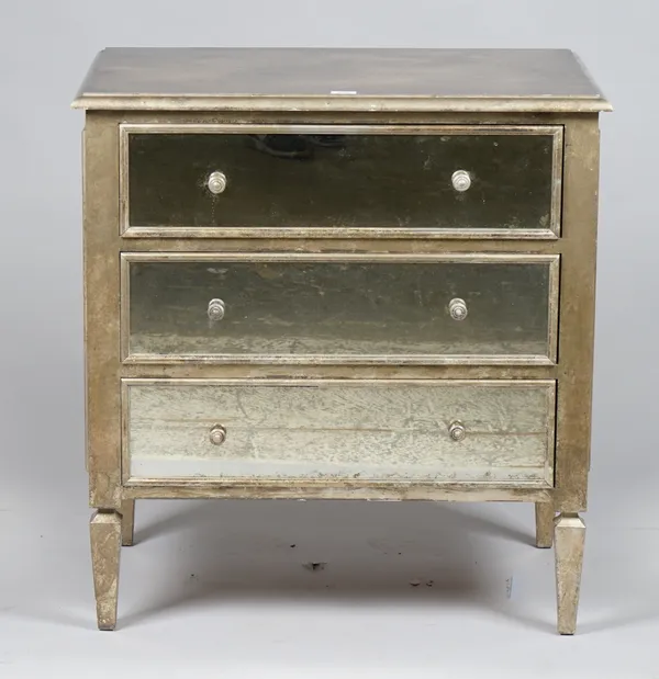 A pair of modern silver painted chests with three mirrored drawers and mirrored sides, maker's plaque to back 'NW', 81cm wide x 86cm high, (2).