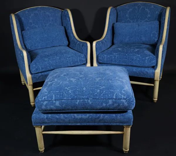 Minton-Spidell, a pair of modern white painted hardwood wingback armchairs with blue foliate upholstery, 71cm wide x 80cm high and a matching rectangu