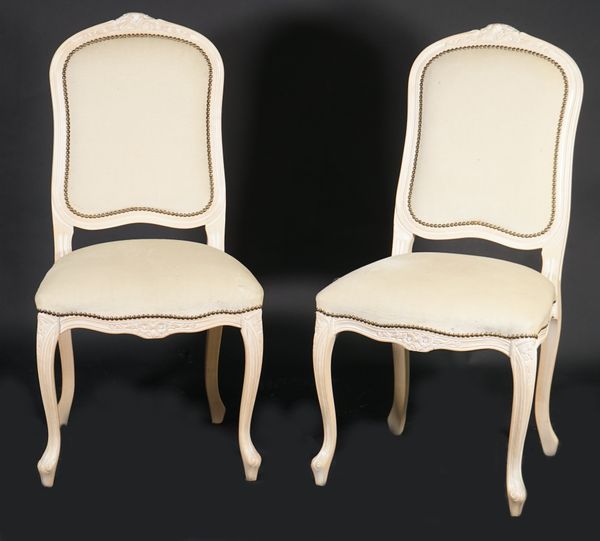 A pair of Louis XV style cream painted and beige upholstered side chairs, 52cm wide x 104cm high, (2).