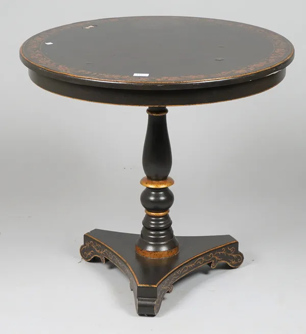 A Victorian style black painted and parcel gilt decorated circular occasional table on trefoil base, 76cm diameter x 71cm high.