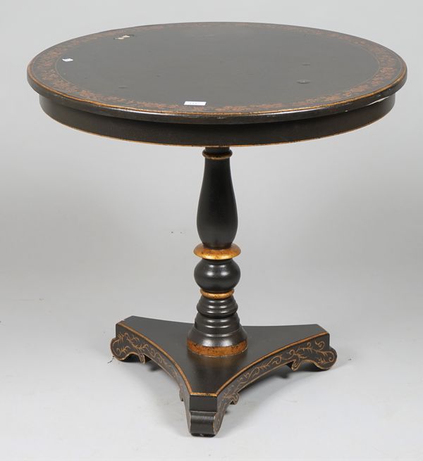 A Victorian style black painted and parcel gilt decorated circular occasional table on trefoil base, 76cm diameter x 71cm high.