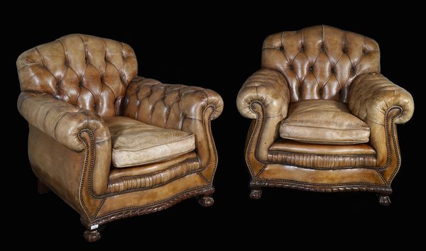 A pair of Victorian style brown button back mahogany framed Chesterfield armchairs on ball and claw feet, 90cm wide x 84cm high.