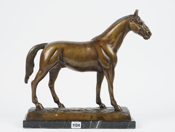 A modern composite bronze stallion, modelled on a naturalistic base and marble rectangular plinth, 40cm high.