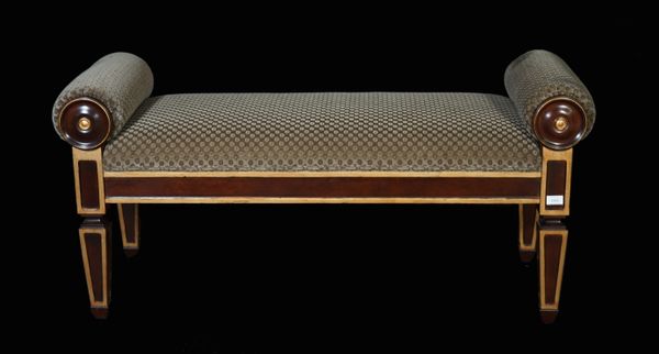 A Regency style mahogany and parcel gilt window seat with rollover arms on tapering square supports, 120cm wide x 60cm high.