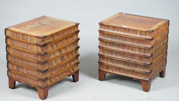 A pair of modern walnut lift top trunks formed as a stack of books, 46cm wide x 51cm high.