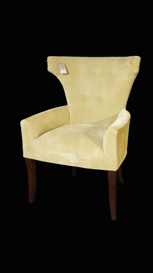 Lewis Mittman, a modern green upholstered wingback armchair on ebonised square supports, 69cm wide x 101cm high, together with a yellow upholstered bu