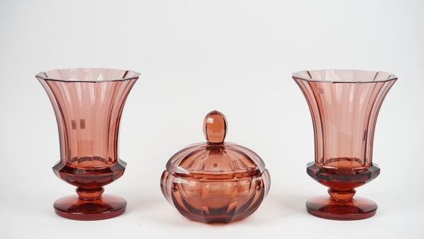 A pair of modern Moser red glass vases of footed form, 30cm high, and a matching Moser bowl and cover, 25cm diameter, (3).