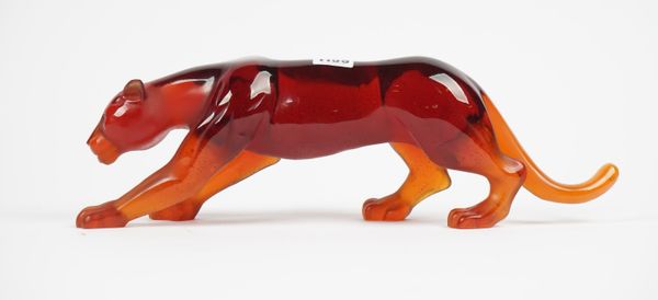 A Daum coloured glass model of a prowling lioness, signed 'Daum France', 43cm.