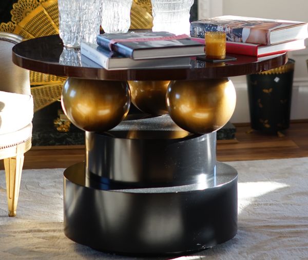 A modern design ebonised centre table, on circular plinth base, 100cm diameter x 72cm high.