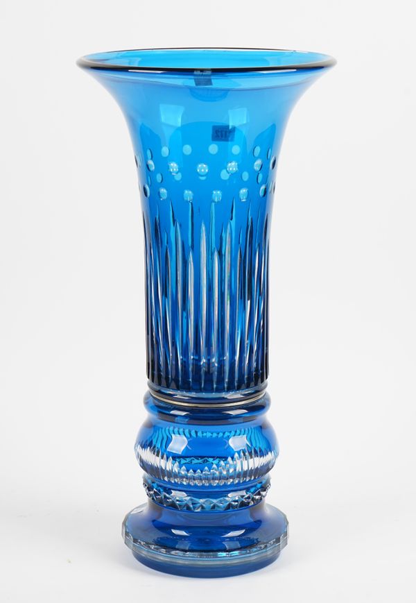 A St Louis blue flashed out glass vase of large proportions, raised on a facet cut base, gift engraved mark 'ROXALES DE ST LOUIS VERRIERS', 59cm high