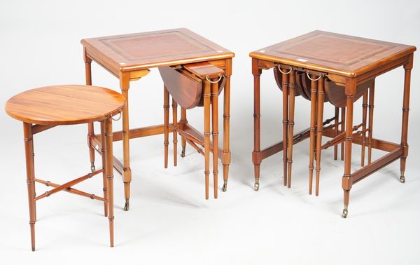 A pair of Regency style mahogany nesting tables, each with two pullout drop flap tables, 48cm wide x 59cm high.