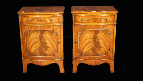 E G Hudson, a pair of George III style mahogany bowfronted bedside tables with single drawer over cupboard on splayed bracket feet, 43cm wide x 64cm h