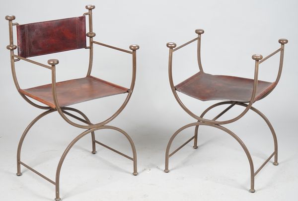 A set of four wrought iron and brown leather open armchairs with 'X' frame supports, 55cm wide x 88cm high and four further, lacking backs, (8).