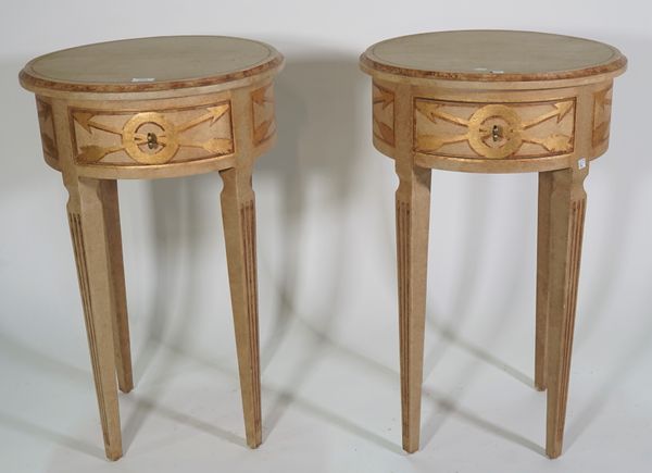 N.W; a pair of modern cream and gold painted Italian circular single drawer occasional tables, on painted fluted tapering supports, 50cm wide x 75cm h