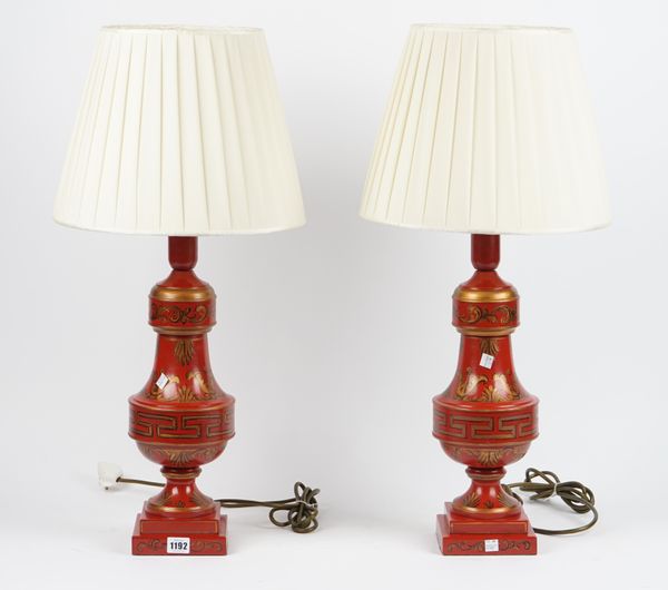 A pair of modern gilt red tole peinte table lamps, each foliate decorated on a stepped square foot, 46cm high, (2).