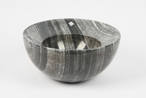 A modern marble bowl, with a wide border and circular recess, 38cm diameter.