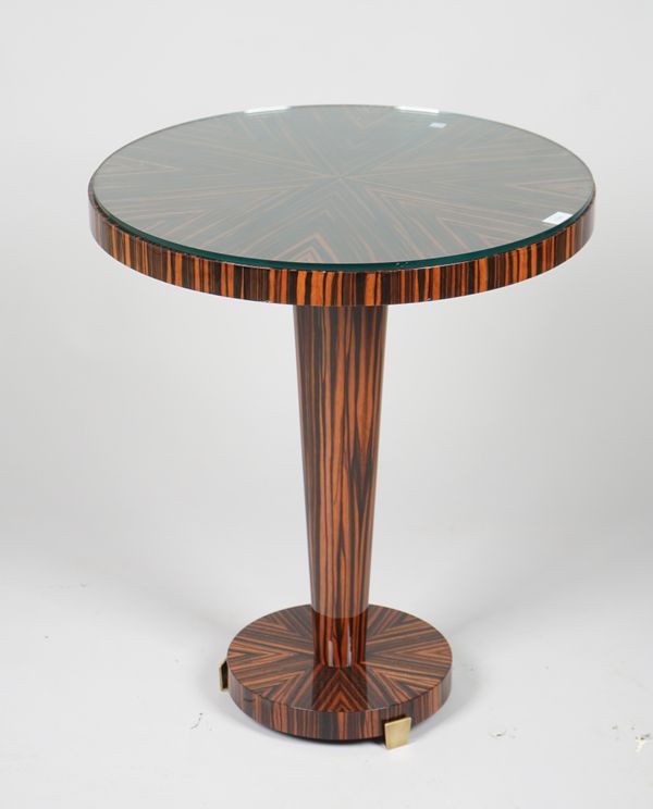 A modern coromandel circular occasional table, on a tapering column and circular plinth base, 60cm diameter x 70cm high.