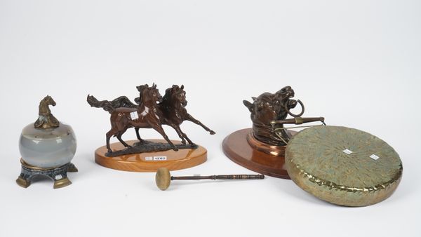 A modern equestrian bronze group on an oval plinth, 28.5cm wide, a wall mounted equestrian gong and a hardstone pot and cover with horse head finial,