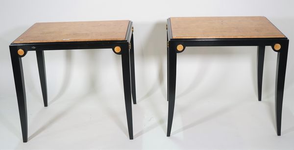 A pair of modern ebonised and polychrome painted side tables, 72cm wide x 70cm high, (2).