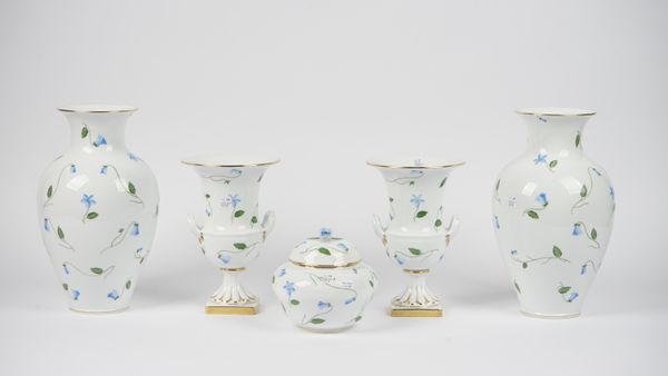 A pair of Herend porcelain 'First Edition' hand painted vases decorated with blue flowers against a gilt white ground, 32.5cm high, a matching pair of