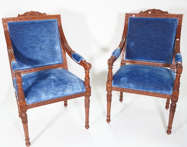 A pair of George III style mahogany blue upholstered open armchairs, on acanthus fluted tapering supports, 62cm wide x 107cm high.