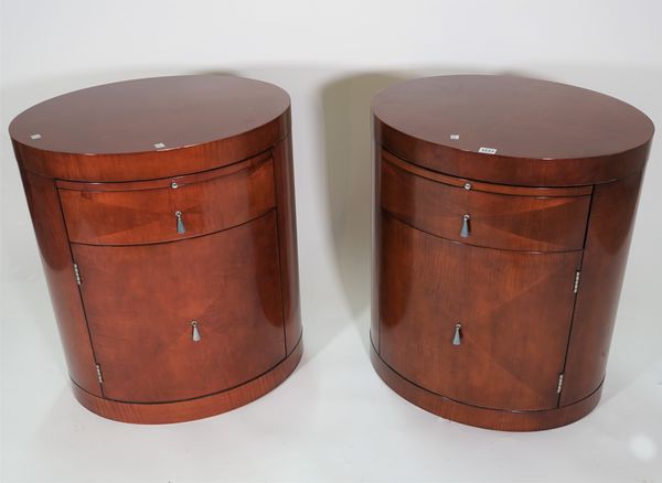 Baker; a pair of modern mahogany oval bedside tables with single drawer, 61cm wide x 71cm high.