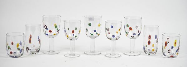 A part suite of Murano style glasses, each with millifiori type inclusions over a plain stem and circular foot, the tallest 18.5cm, (36).