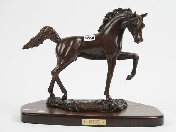 A modern patinated bronze horse 'The Arabian' by Dick Sloviaczek, raised on a shaped oak plinth with attached titled plaque, bronze, 29cm high.