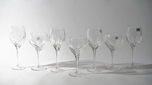 Fifteen Baccarat style crystal wine glasses, 26.5cm high, and three cocktail glasses, 22cm high, etched mark for 'Thomas Goode', (18).