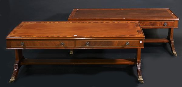 A pair of George III style mahogany rectangular two drawer low tables, on dual ended outswept supports, 137cm wide x 48cm high, (2).