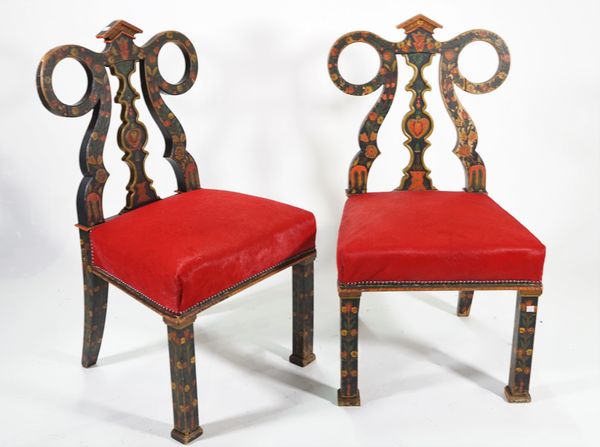 A pair of modern Continental painted hall chairs, on square block supports, 51cm wide x 99cm high, (2).