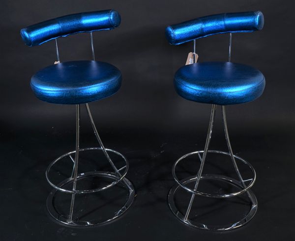 A pair of modern chrome bar stools, with electric blue faux leather upholstery, 42cm wide x 98cm high, (2).