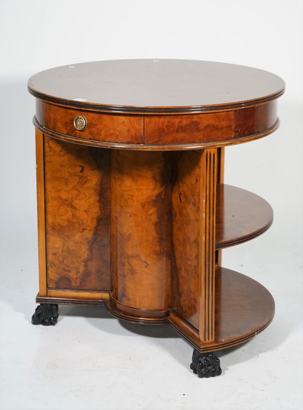 A Victorian style walnut circular two tier bookcase, with single drawer, on ebonised claw feet, 68cm diameter x 72cm high.