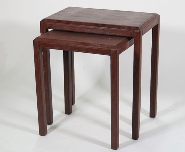 A modern nest of two tables, with faux brown lizard skin upholstery, 55cm wide x 60cm high.