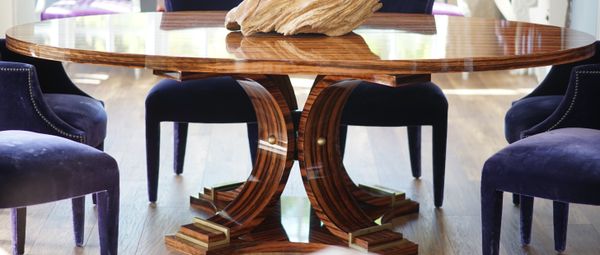 A modern oval coromandel dining table, 233cm wide x 77cm high.