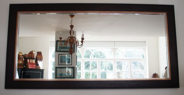 A modern large hardwood and gilt slip mirror, 242cm wide x 122cm high.