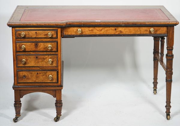 Lamb Manchester; a late Victorian writing desk with one long and four short drawers about the knee, on ring turned supports, 117cm wide x 74cm high.