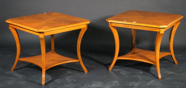 A pair of modern lamp tables, each on swept legs with an undertier, 65cm wide.